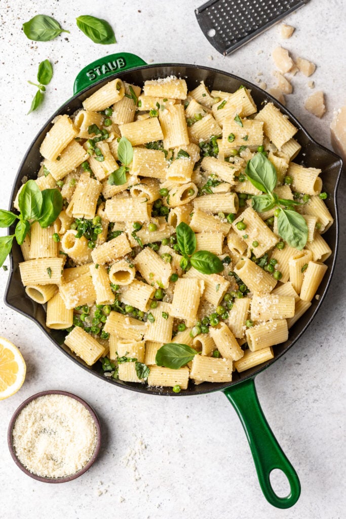 skillet with pasta, cheese and peas