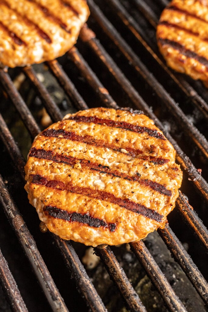 grilled chicken burger patty on a grill