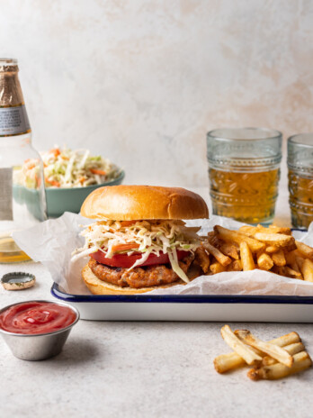 grilled bbq chicken burger with coleslaw and fries
