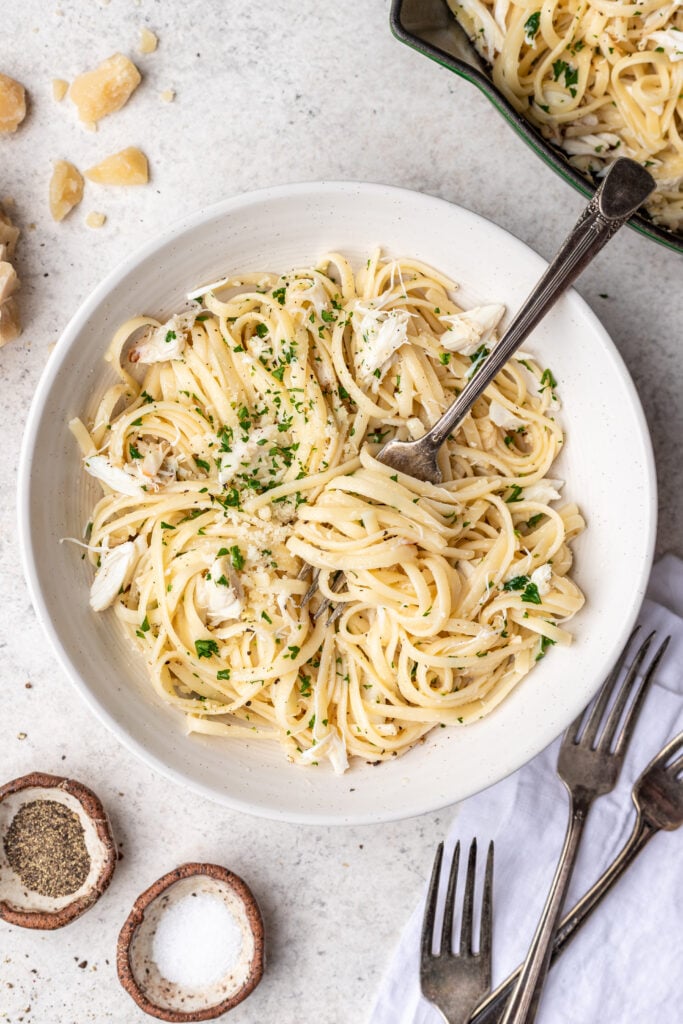 crab pasta in a bowl with a fork