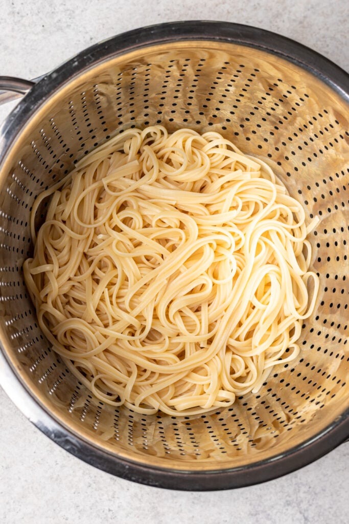 linguine pasta drained in a strainer