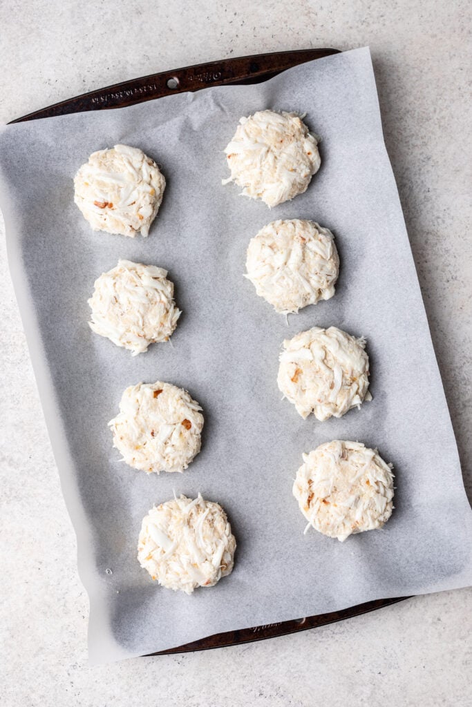 fresh crab cakes on a sheet pan