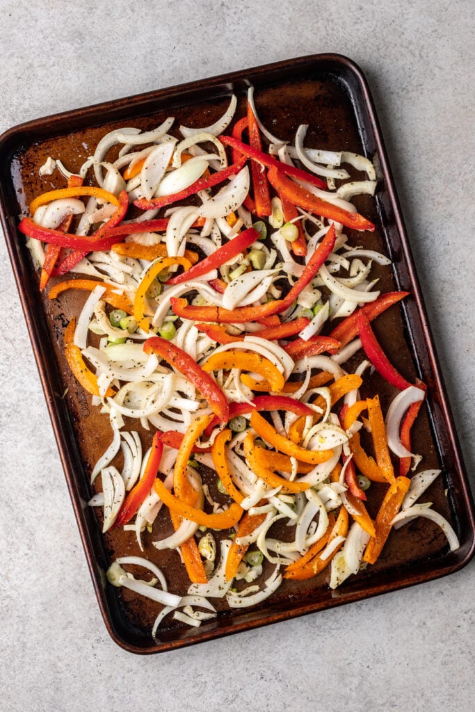 sheet pan with sliced raw veggies