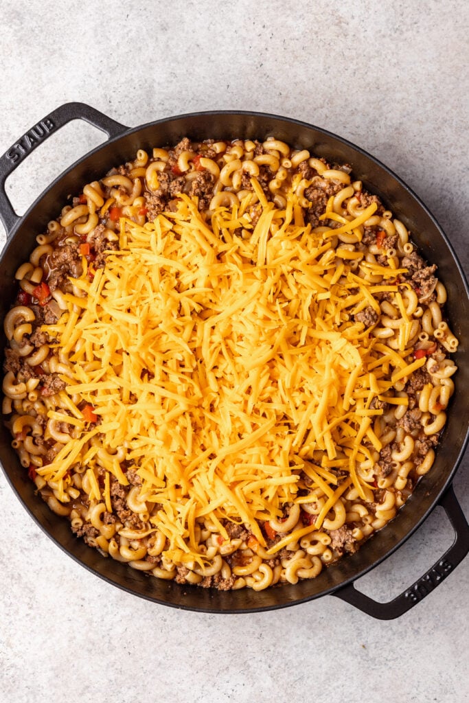 shredded cheese on top of sloppy joe pasta