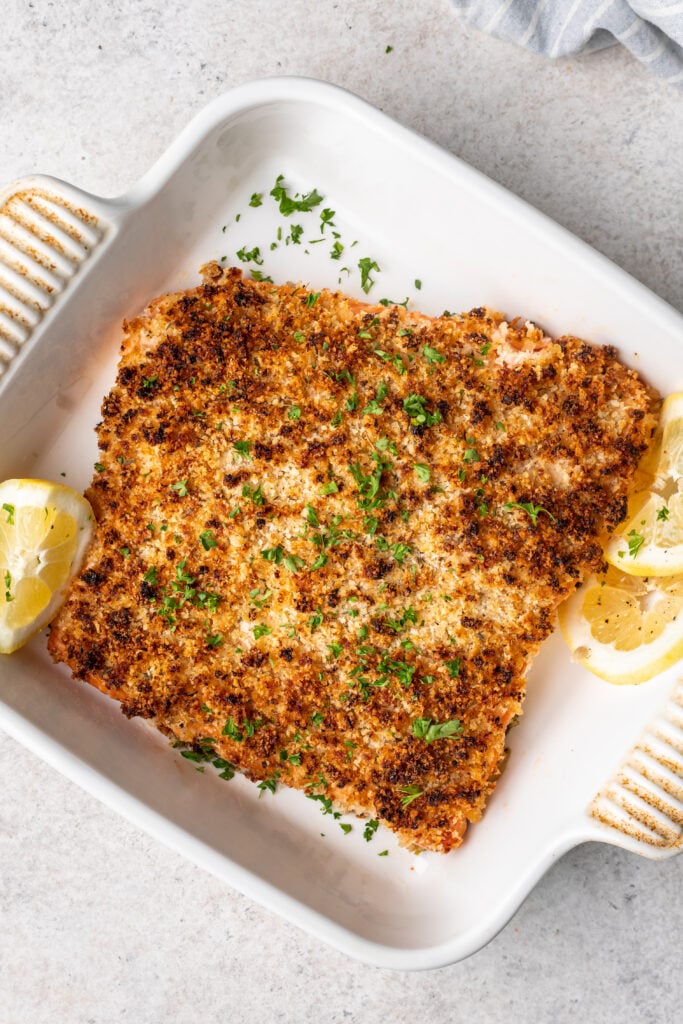 baked salmon with panko breadcrumbs, lemon slices and parsley