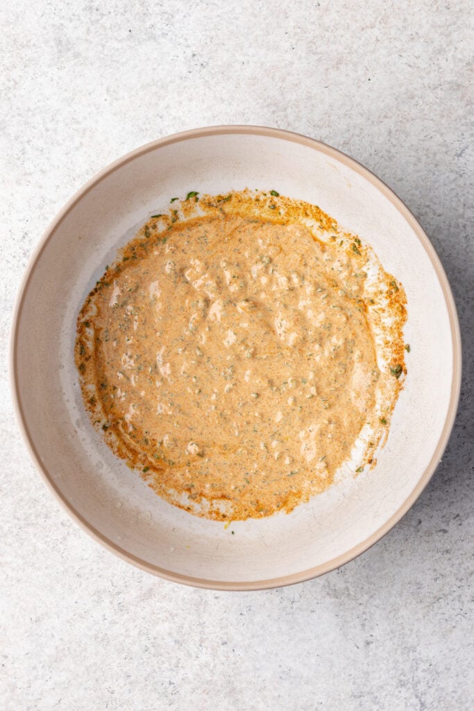 yogurt and spices mixed in a bowl