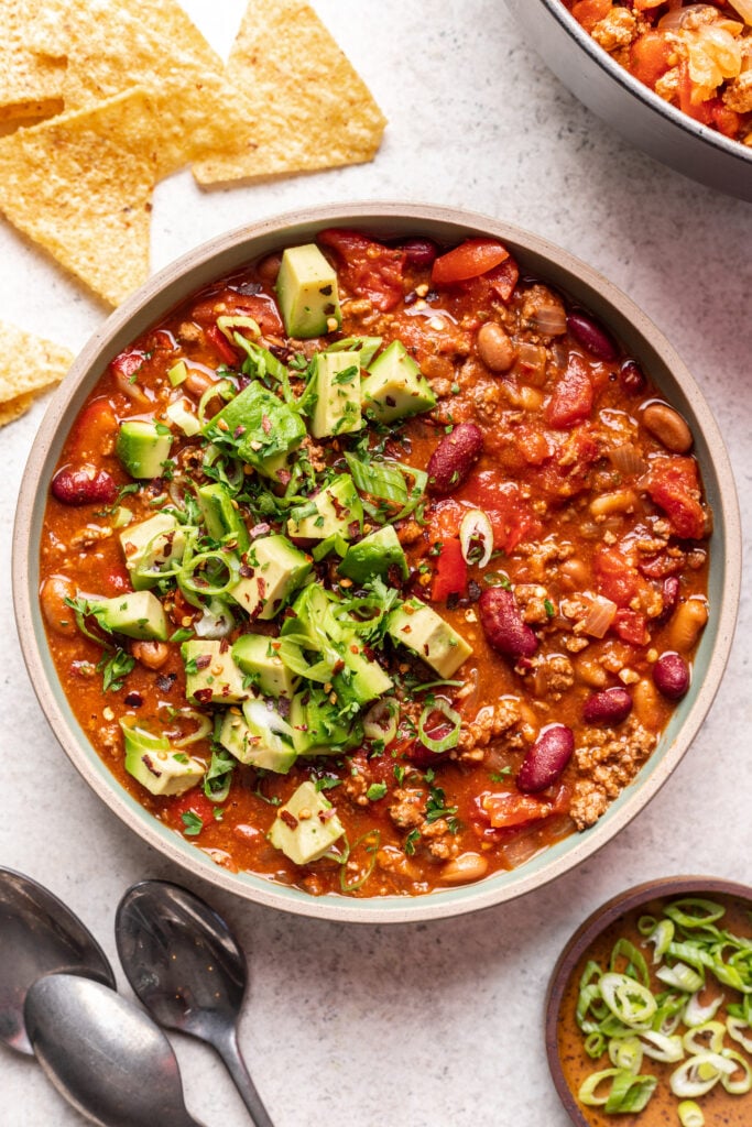 ground beef chili with avocado and green onions