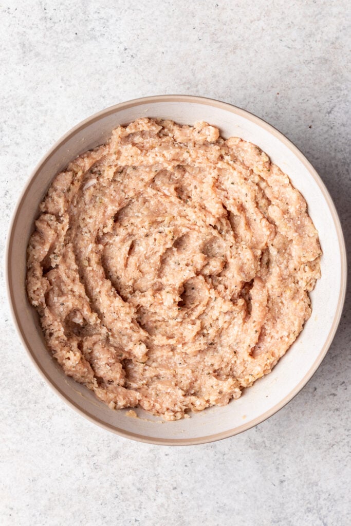 raw ground chicken in a bowl