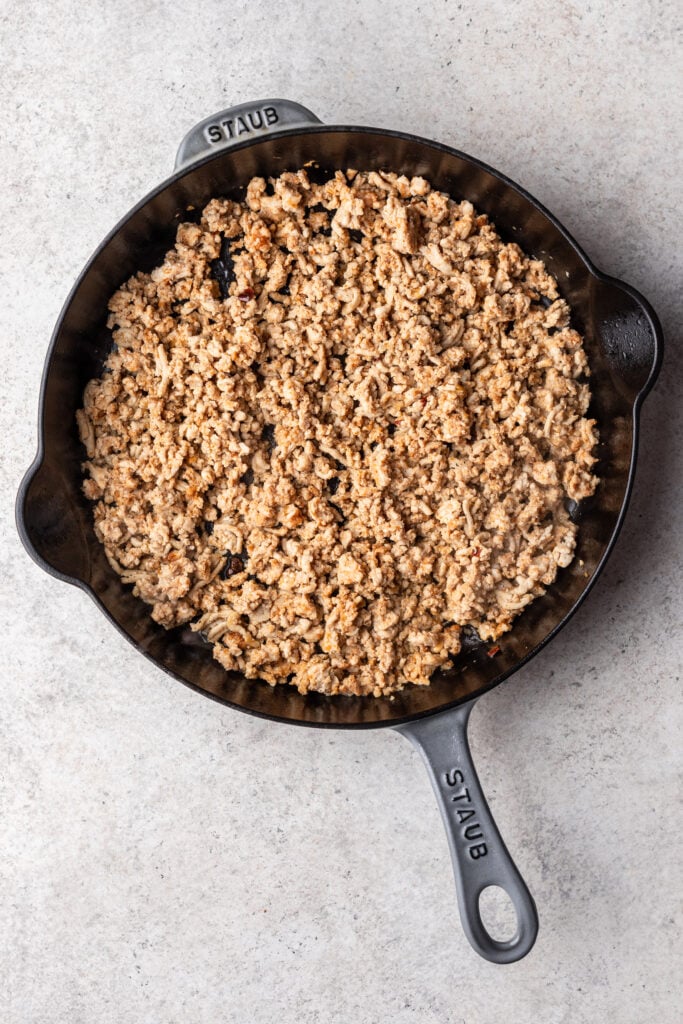 ground chicken in a cast iron skillet