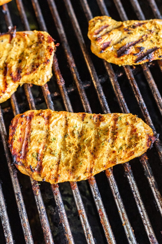 grilled yogurt marinated chicken on the grill