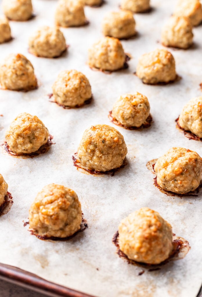 baked chicken meatballs on a sheet pan