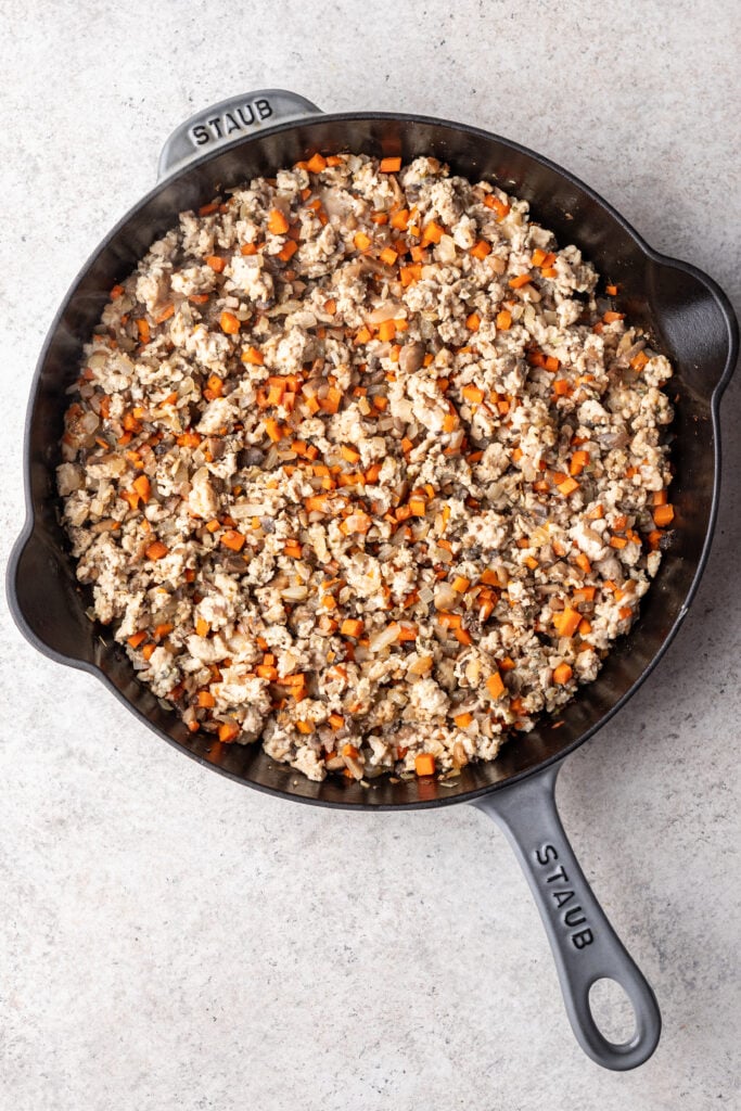 skillet with sauteed veggies and ground meat