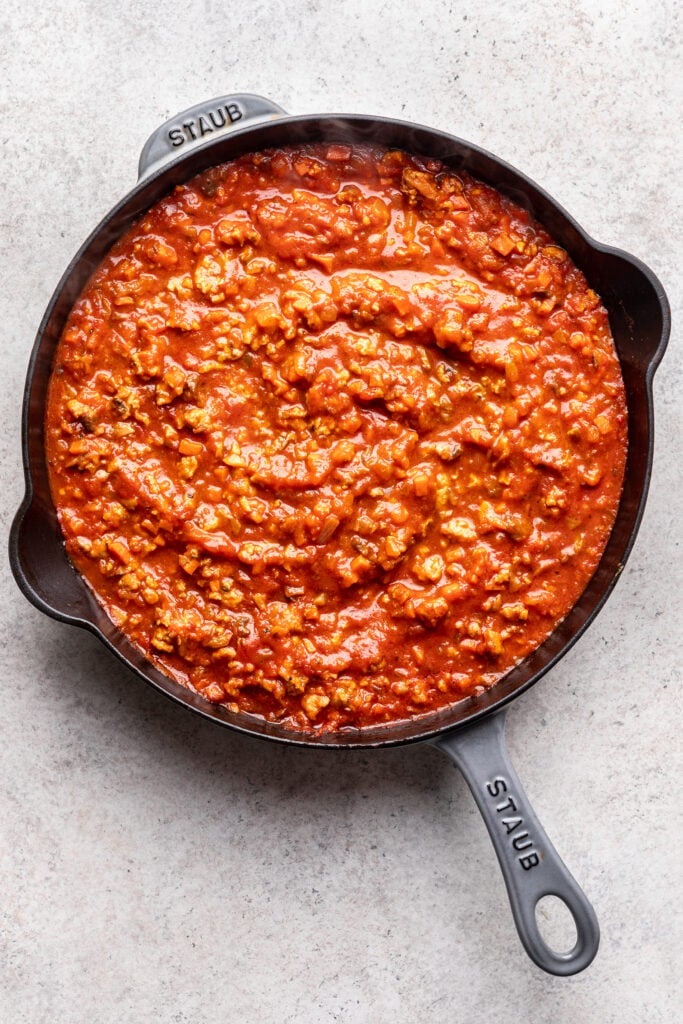 ground chicken bolognese sauce in a skillet
