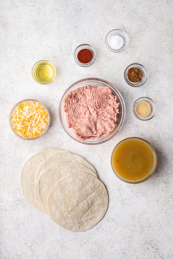 bowls of ingredients on a grey background