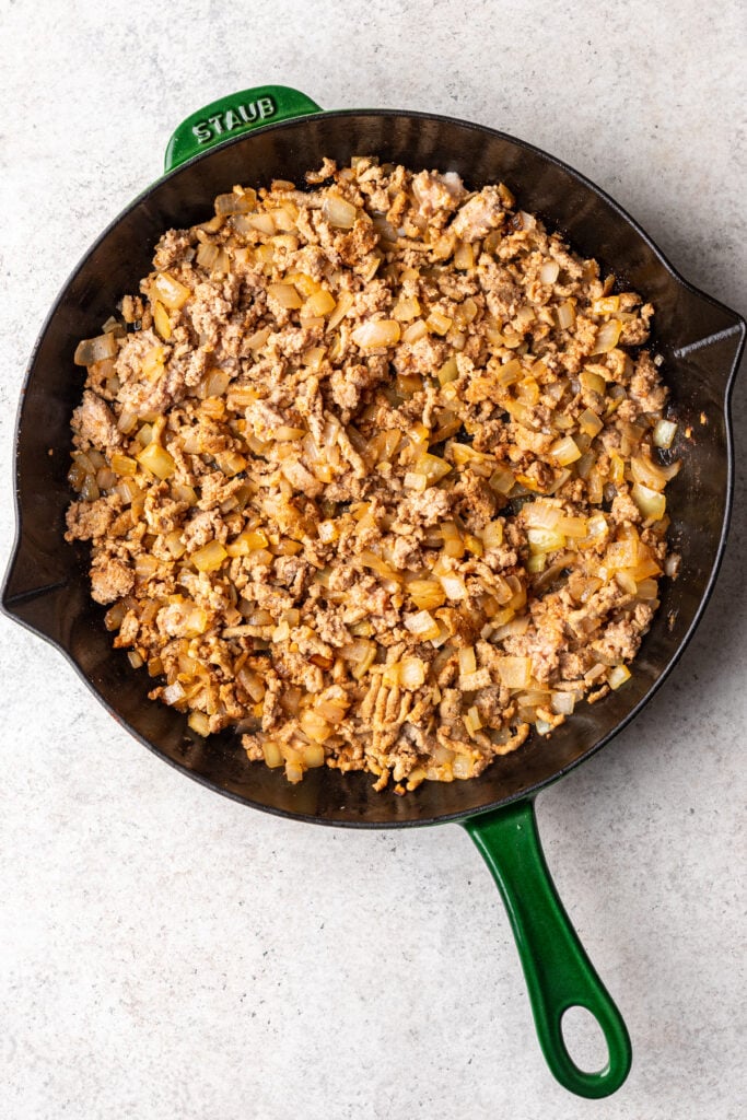 ground turkey and spices in a skillet