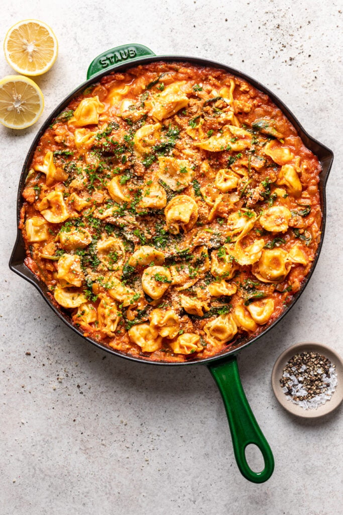 tortellini pasta in a skillet with ground turkey
