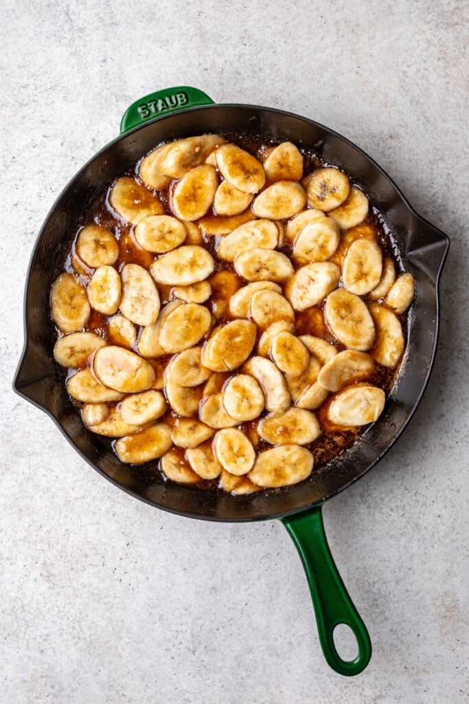 skillet with butter, brown sugar and sliced bananas