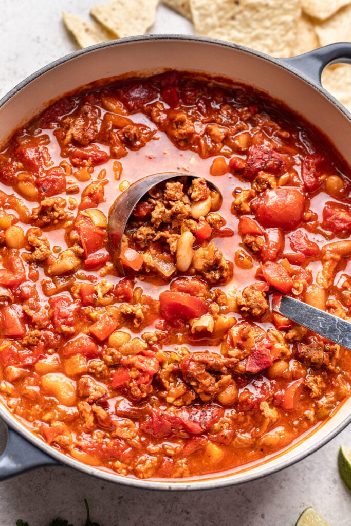 pot of chicken chili with a ladle