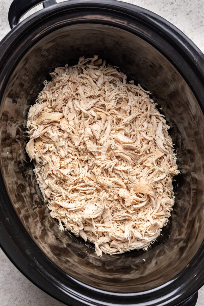 shredded chicken in a slow cooker