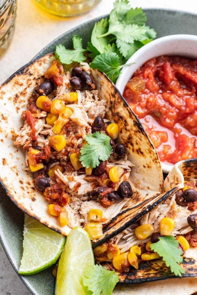 shredded chicken taco with a side of salsa