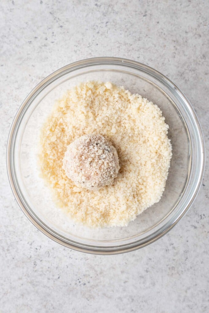 one chicken meatball in a bowl of panko
