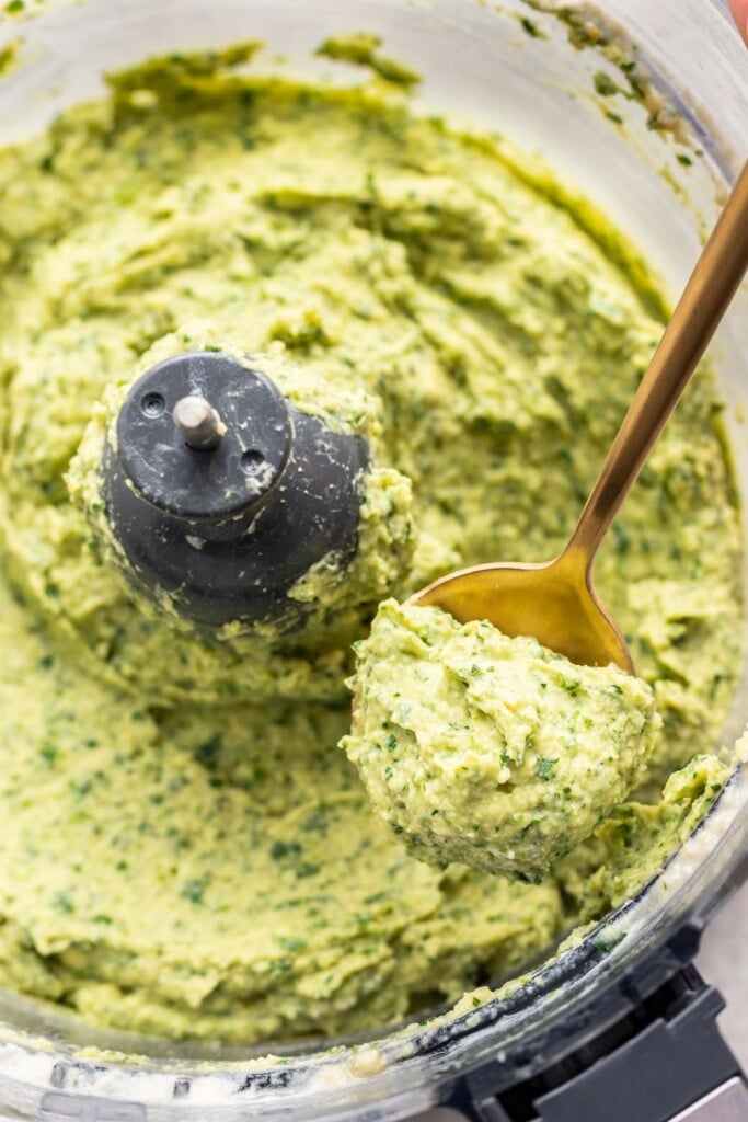 herb avocado dip on a spoon