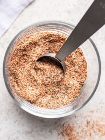 spice mixture in a glass with a measuring spoon