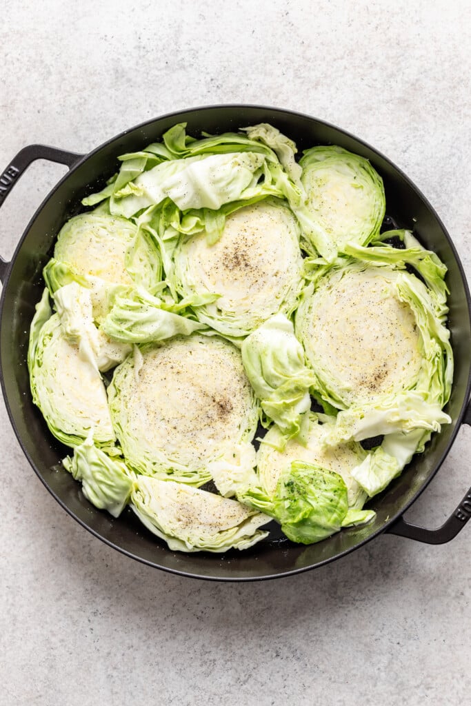 cast iron skillet with sliced cabbage
