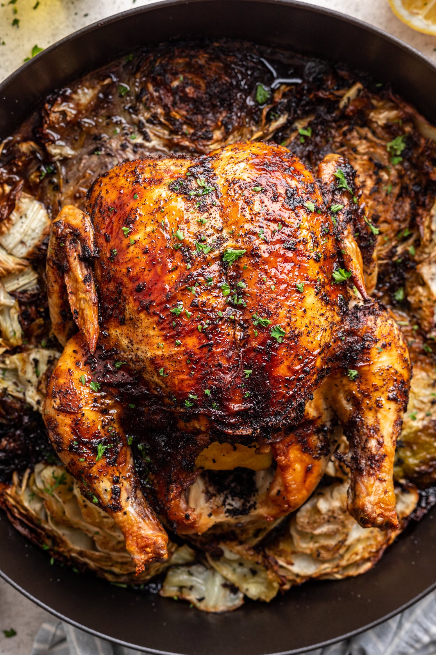 whole roast chicken on a bed of cabbage