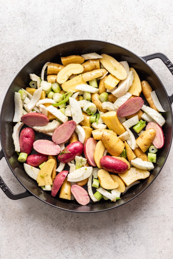 cast iron pan with potatoes and fennel
