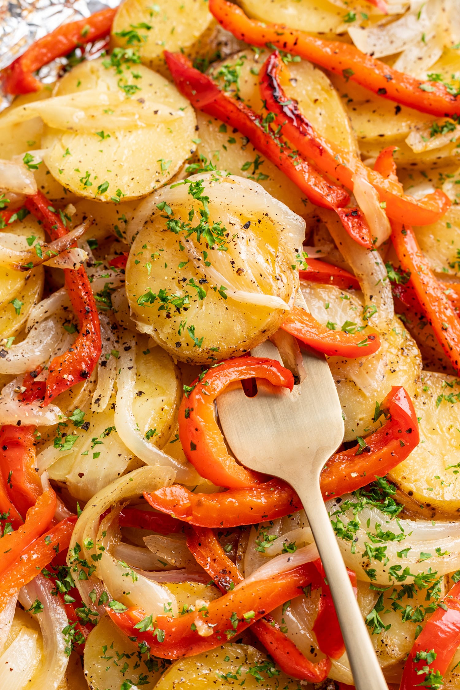 grilled potatoes with a fork