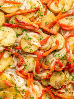 sliced grilled potatoes with bell peppers and onion
