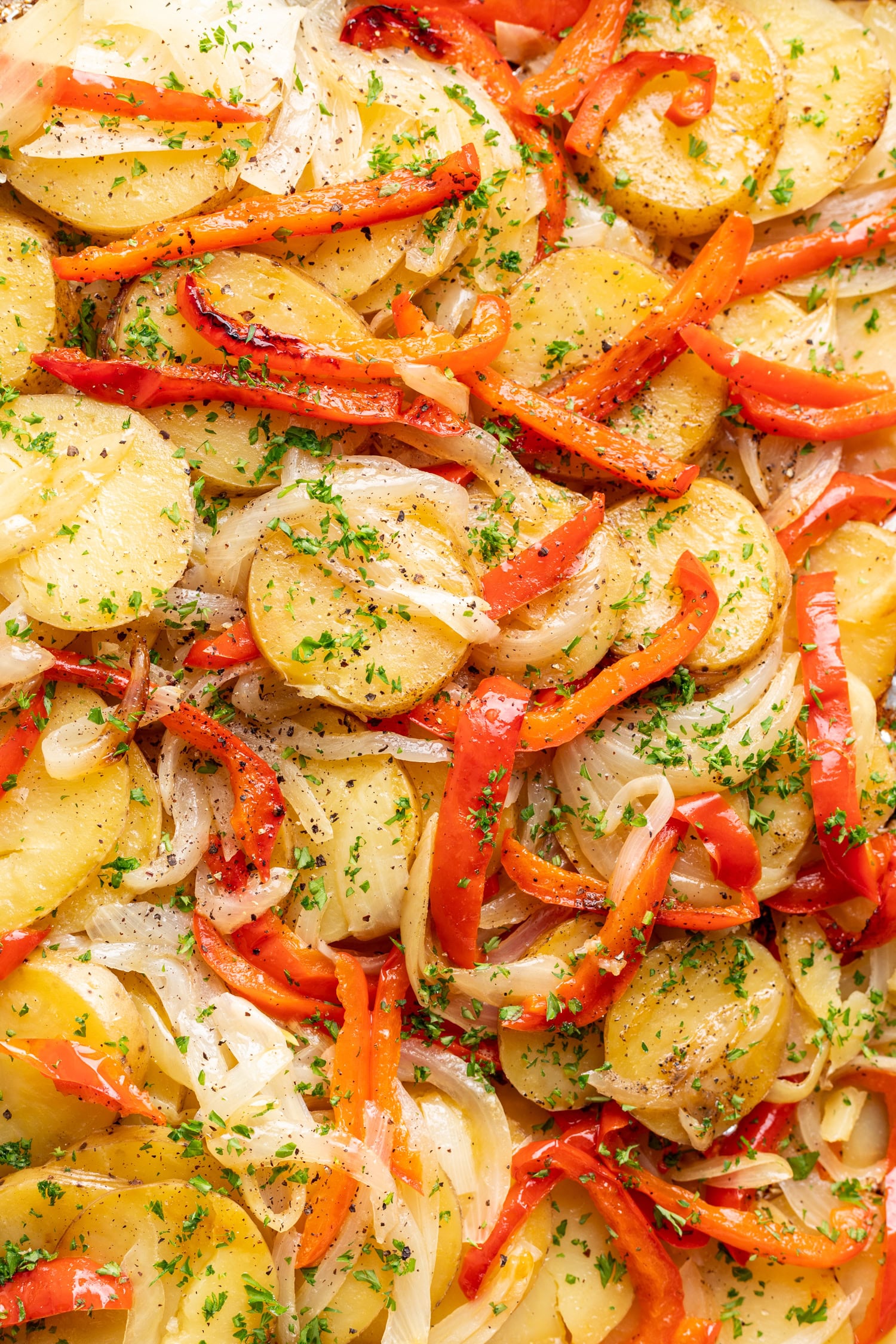 sliced grilled potatoes with bell peppers and onion