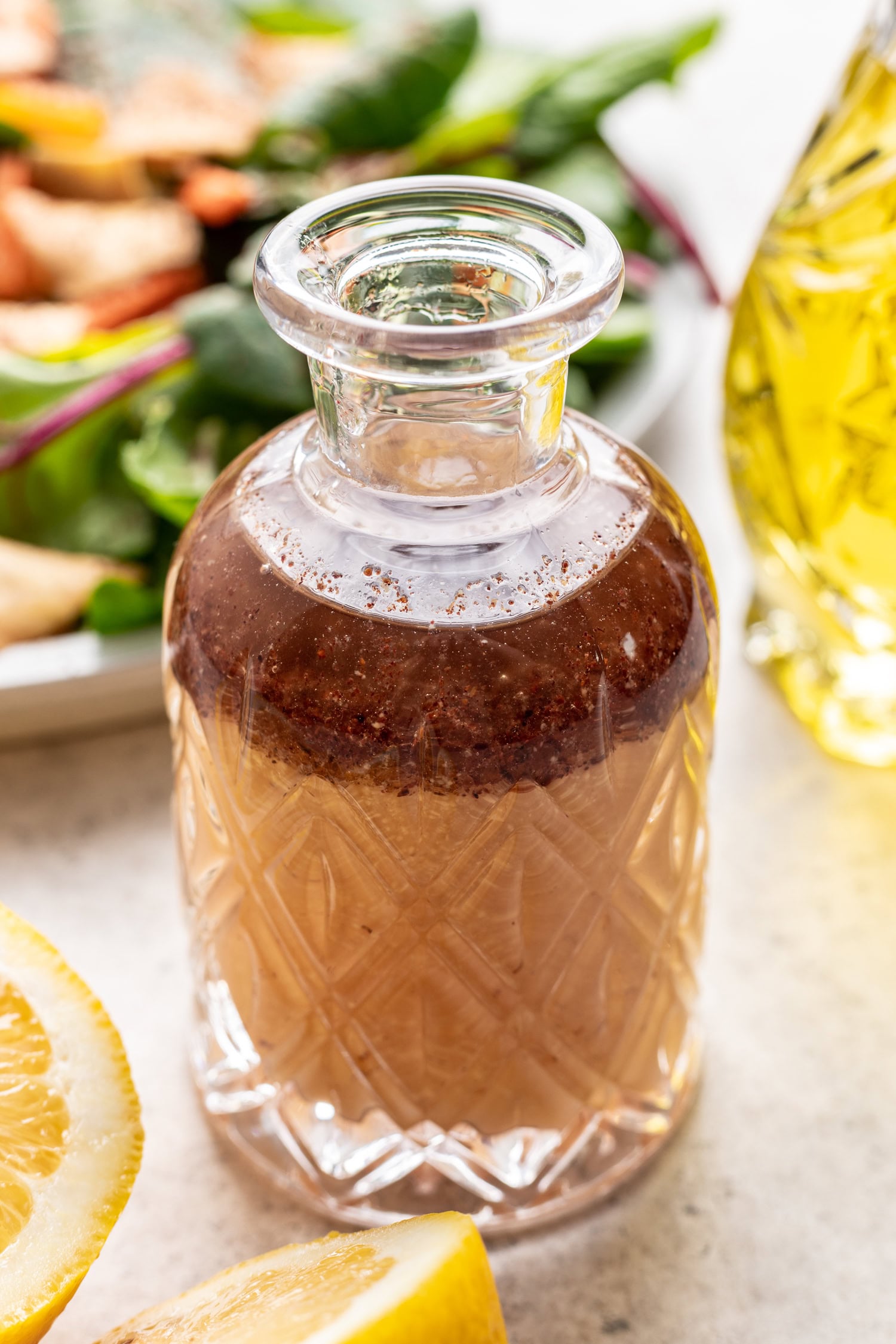 lemon sumac dressing in a glass bottle