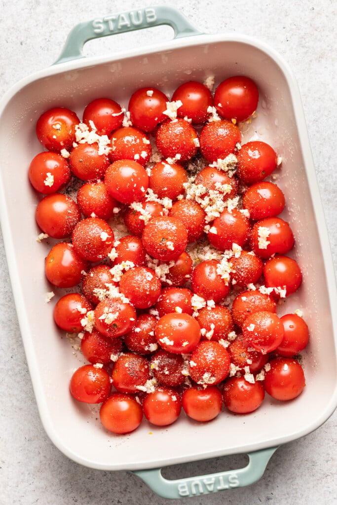 baking dish with cherry tomatoes and spices