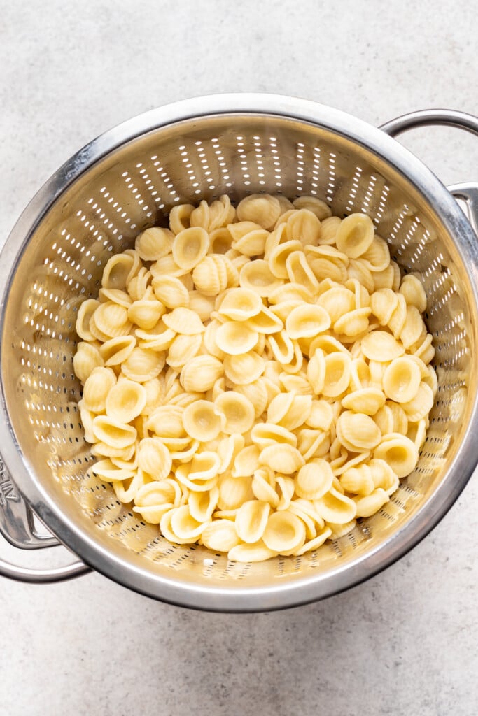 strainer with cooked pasta