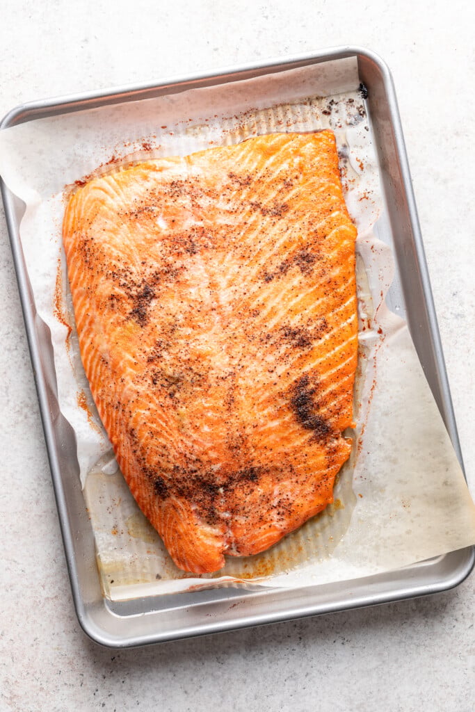 large piece of cooked salmon on a sheet pan