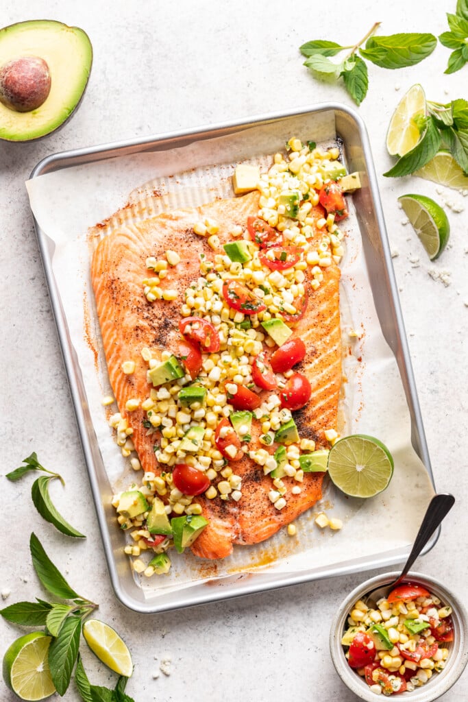 roast salmon with fresh corn salsa on a sheet pan