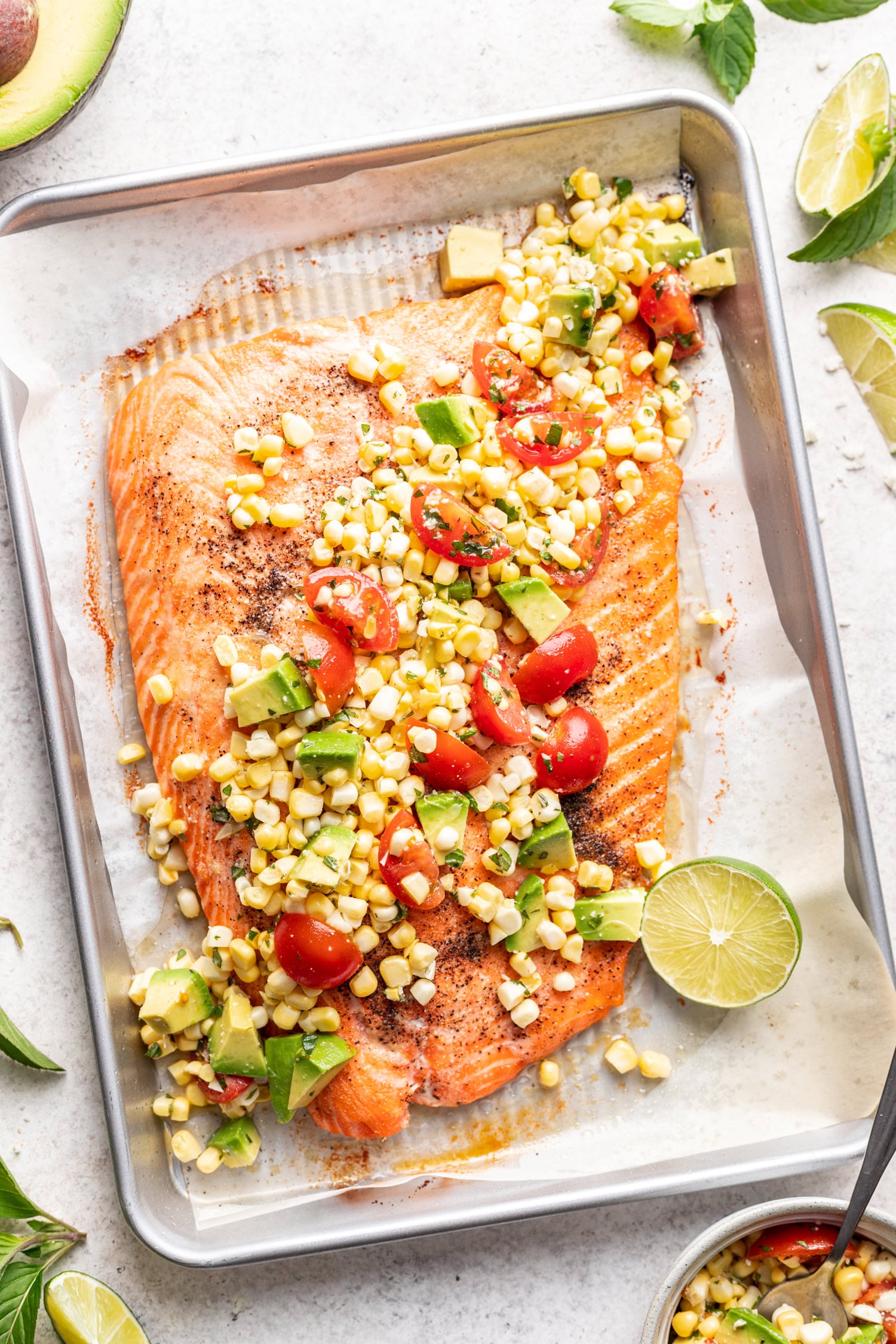 salmon with corn salsa on a sheet pan