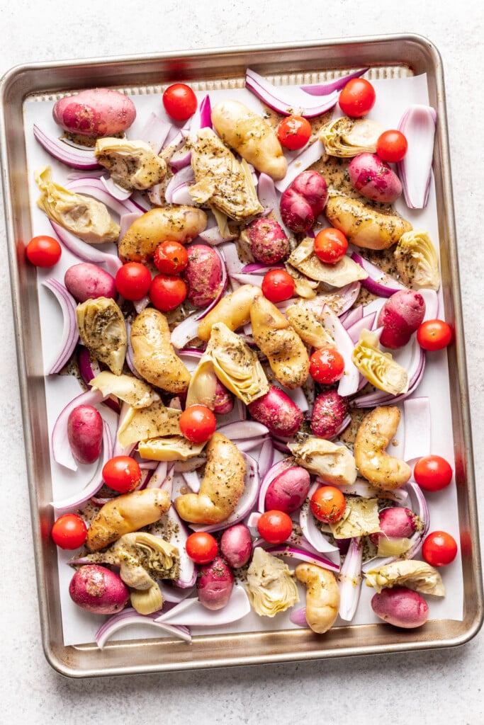 sheet pan with potatoes, tomatoes and onion
