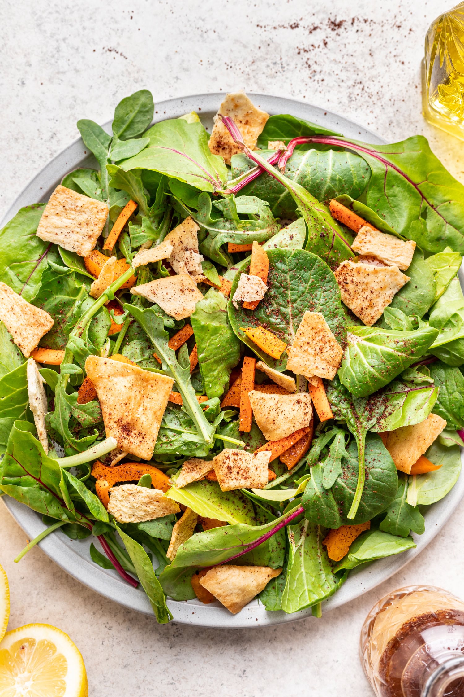 green salad on a white platter