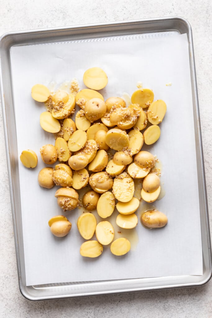 sheet pan with parchment paper and cut potatoes