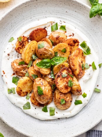 roasted potatoes on a bed of greek yogurt