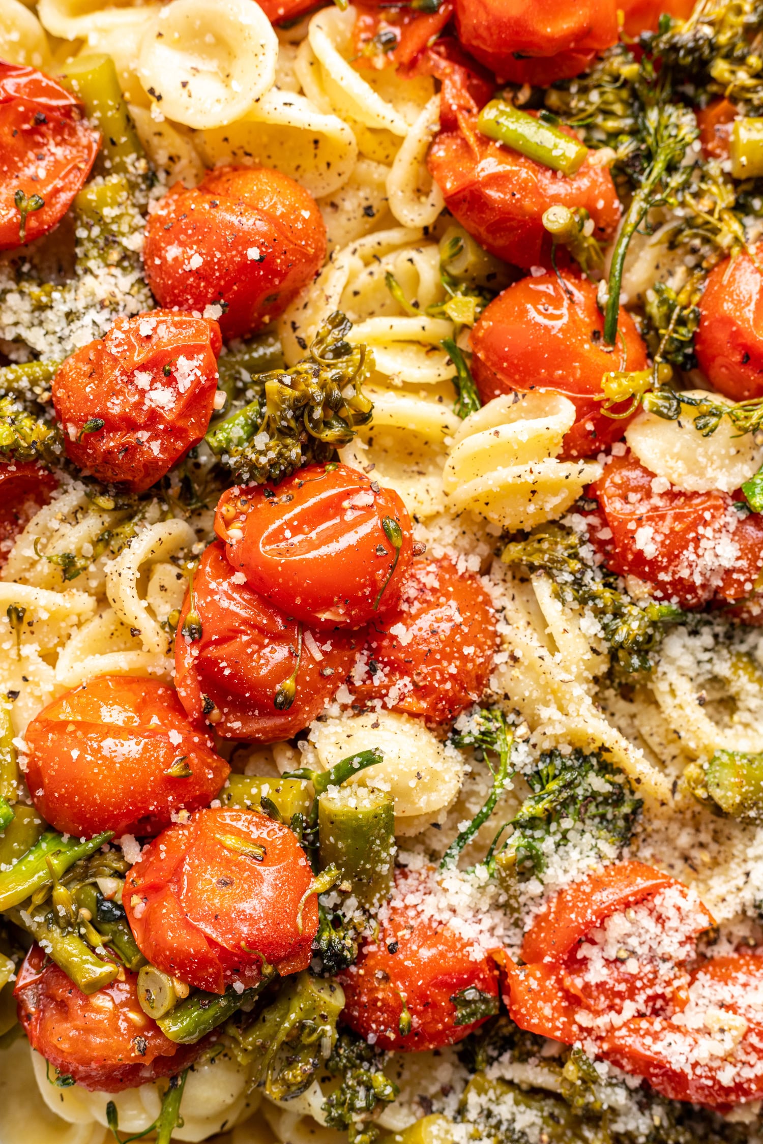 burst cherry tomatoes and broccolini over pasta