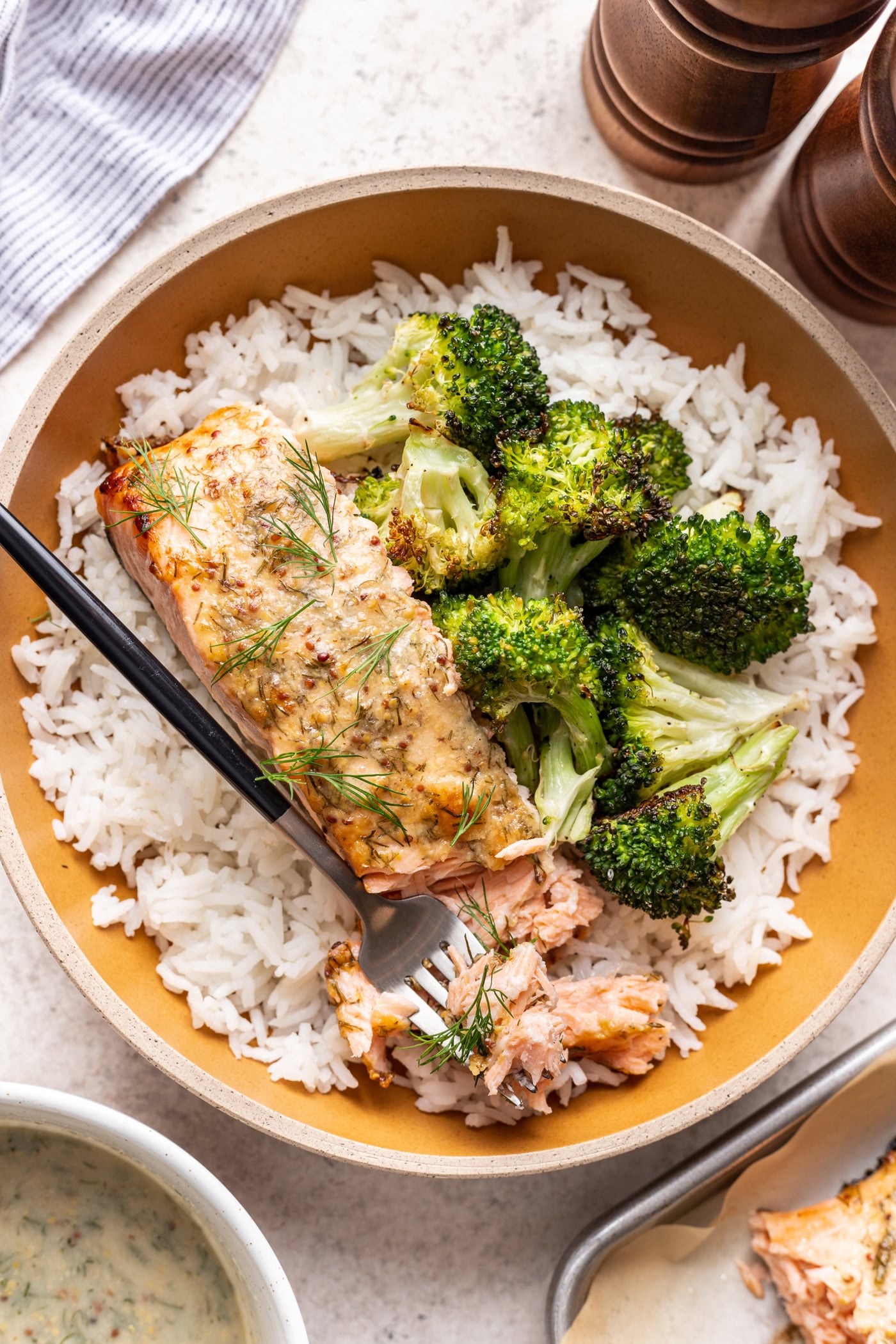 salmon in a bowl with broccoli and white rice