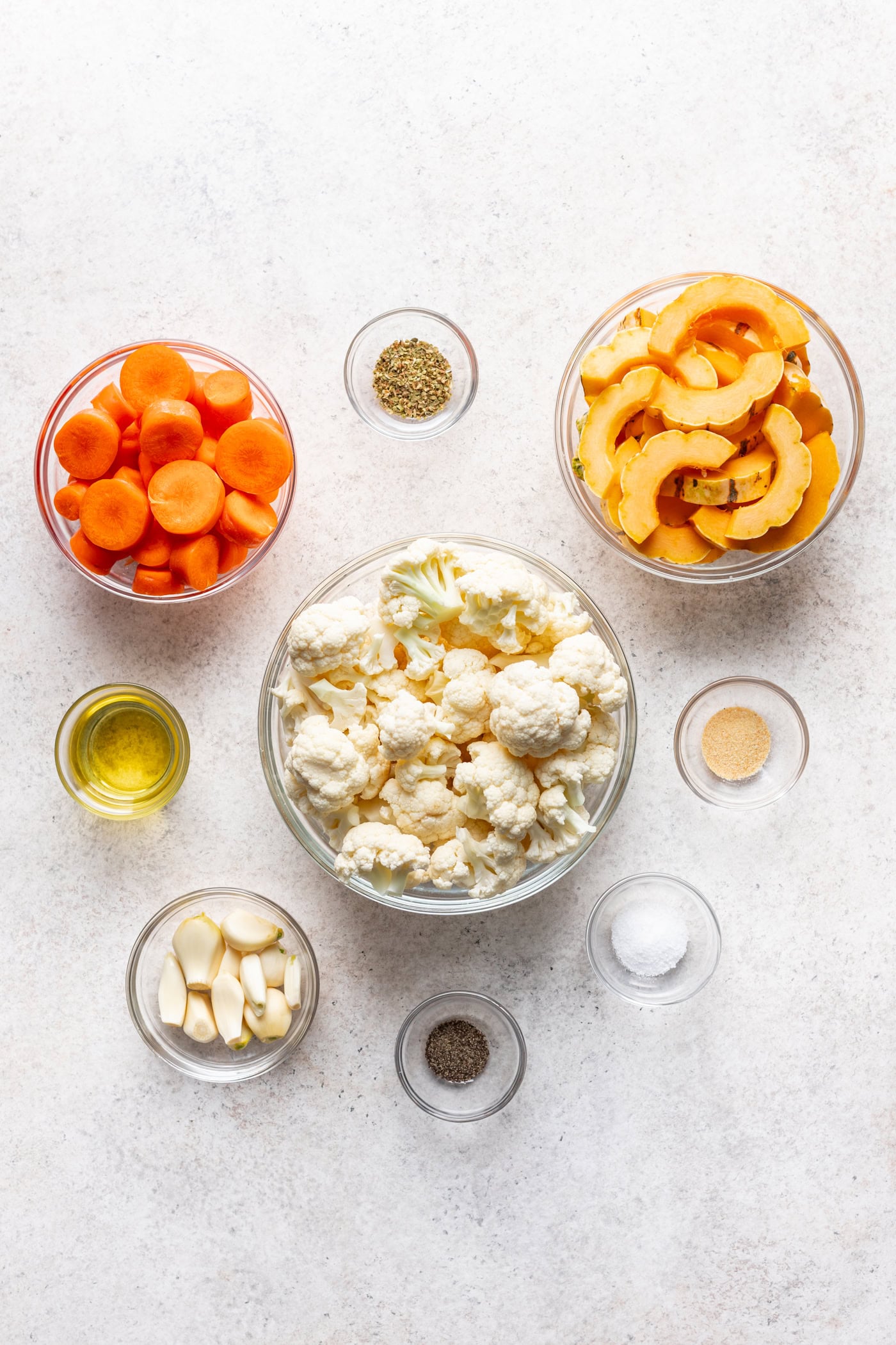 bowls of ingredients on a grey background