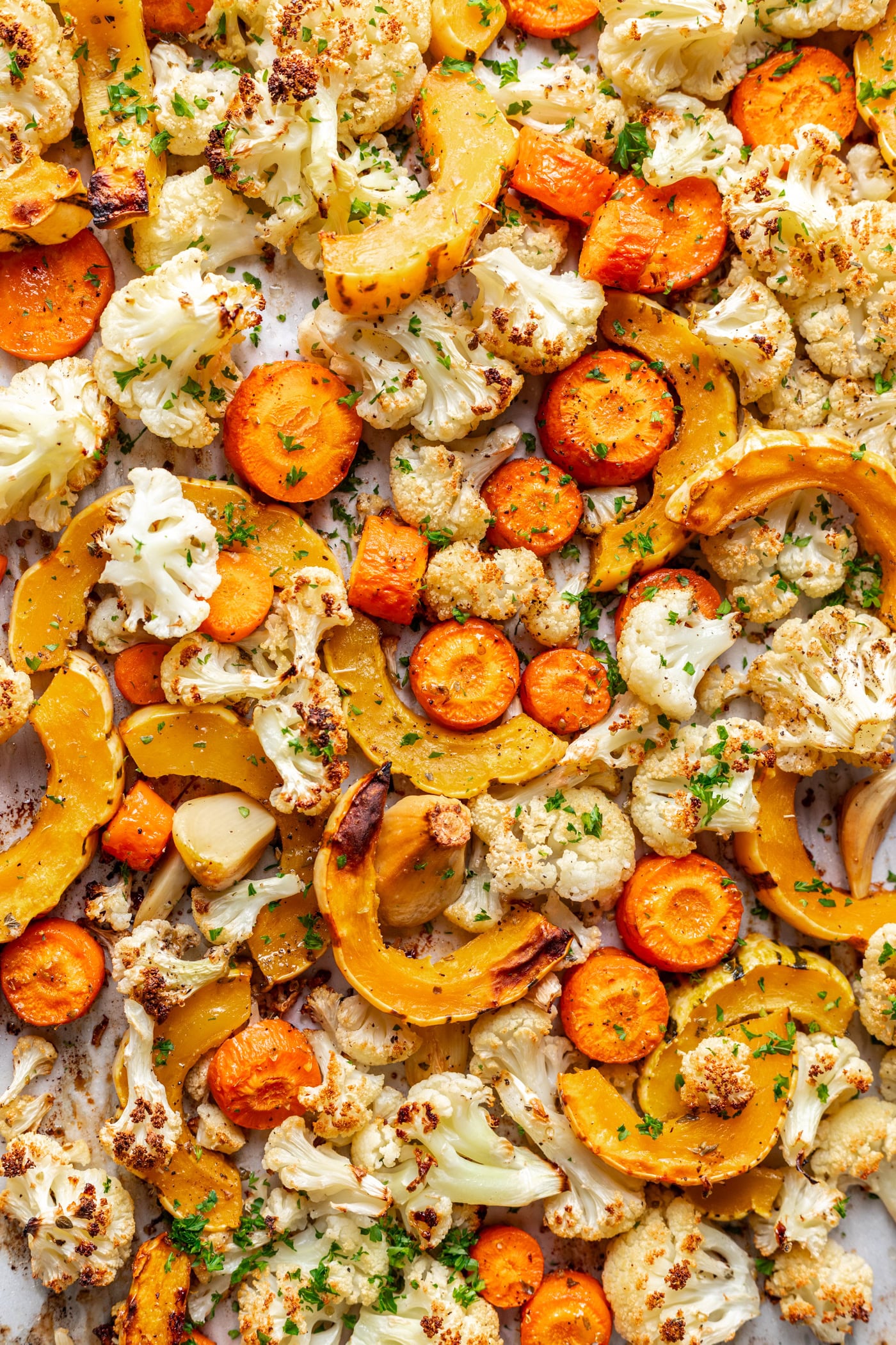roasted cauliflower, carrots and squash on a sheet pan