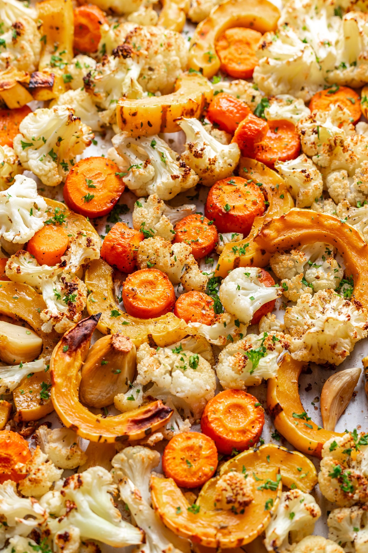 roasted veggies on a sheet pan such as carrots, squash and cauliflower