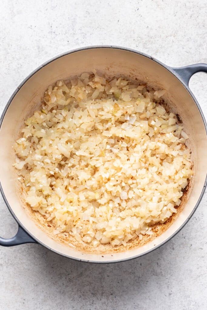 shredded onions and garlic in a big pot