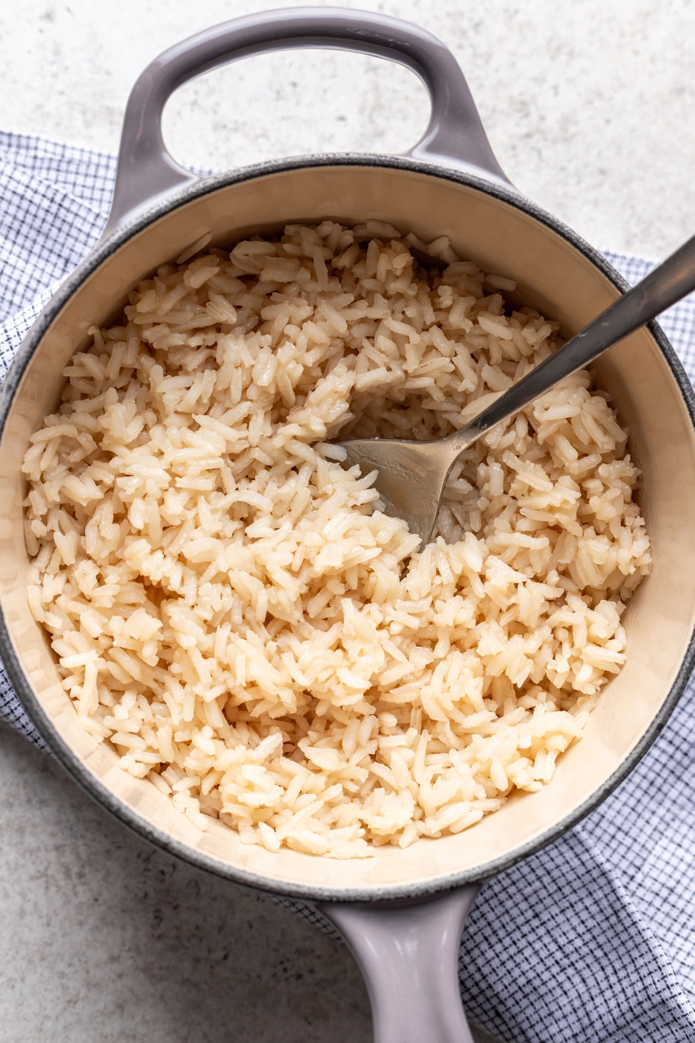 bone broth rice in a large pot with a spoon